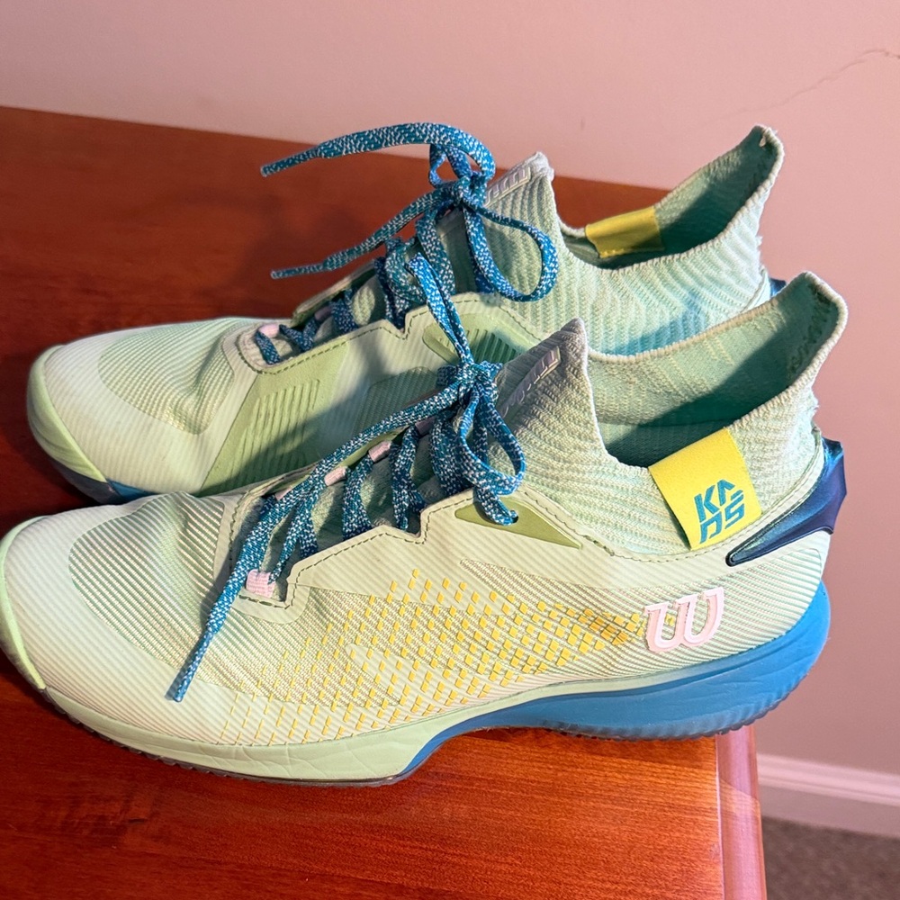 Wilson Mint Green Tennis Shoes with Blue Laces and Yellow Accents pre owned. 9.5